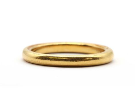 A gold wedding ring, tested as approximately 22ct gold, 2.90mm wide, 2.40mm deep, 6.70g.Finger size QCondition ReportSurface 