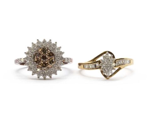 A 9ct gold diamond cluster ring,with a marquise shaped cluster of eight cut diamonds, to crossover shoulders channel set with