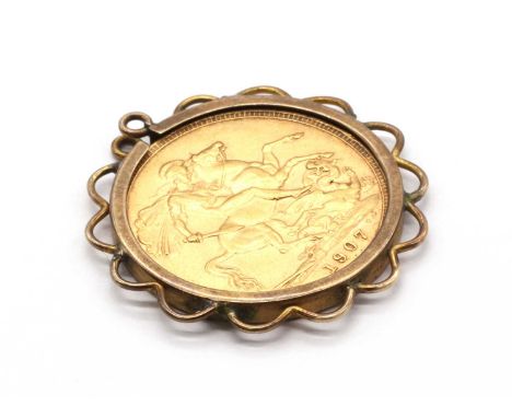 A sovereign pendant, an Edward VII sovereign, dated 1907, spectacle set to a gold mount with scalloped frame, tested as appro