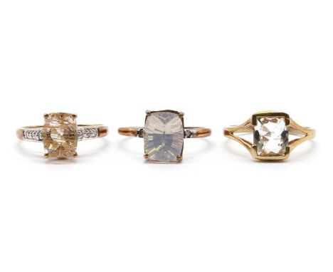 Three 9ct gold rings,comprising a single stone petalite ring, Birmingham, a rutilated quartz and diamond ring, Birmingham, an