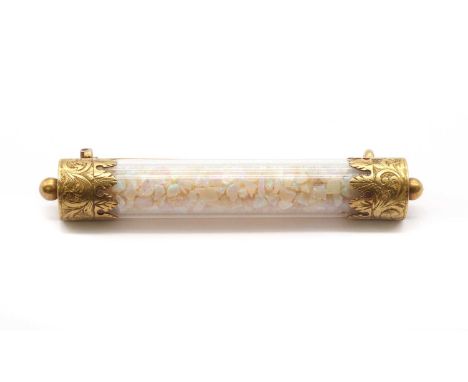 A Victorian opal and glass bar brooch, a clear glass cylinder containing opal chips, to engraved gold end caps, with pin and 