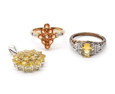 Two 9ct gold rings,comprising an orange sapphire and diamond ring, Birmingham, and a yellow fire opal and diamond ring, Birmi