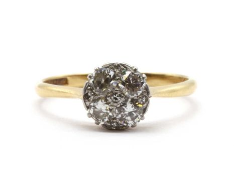 A gold diamond cluster ring,an eight cut diamond grain set at the centre, to quatrefoil surround of brilliant cut diamonds, w