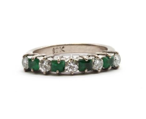 A white gold diamond and emerald half eternity ring,an alternating row of brilliant cut diamonds and square step cut emeralds