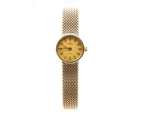 A ladies' 9ct gold Garrard quartz bracelet watch, 21mm diameter, with a champagne dial and baton hour markers, the case back 