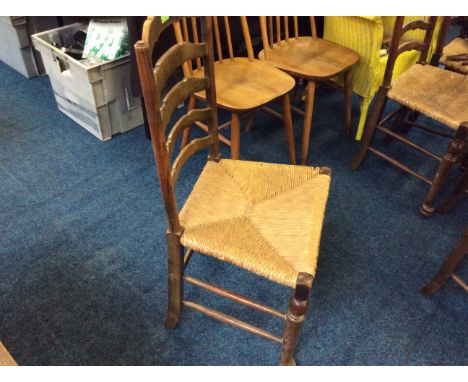 A set of six farmhouse style ladder back dining chairs with rush suit