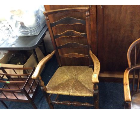 A rush seated ladder back chair.