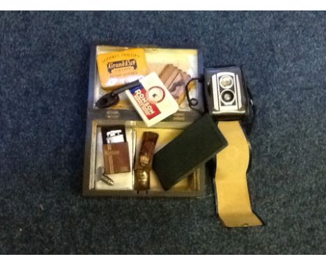 A wood and pearl inlay box containing various items including a Ronson lighter and service outfit, a folding ruler, cigarette