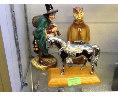 A mounted model horse cigarette lighter with Foreign decanter with head cork and Royal Doulton figurine 'The Mask Seller'.