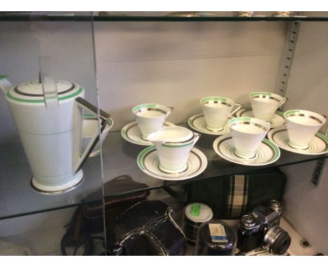 A Shelley tea set including five tea cups, six saucers, a milk jug, sugar bowl and tea pot.