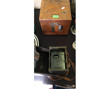 A Benzing cased pigeon clock together with a Skymaster Ghost high speed timing clock.