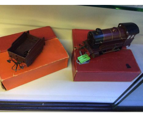 A Hornby 5600 type 501 engine with four boxed Hornby wagons and carriages.