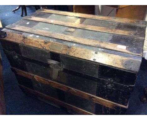 A wood bound travel trunk with part interior and brass plaque inscribed with John H. Dick, Maker, 62 W.Madison St, Chicago.