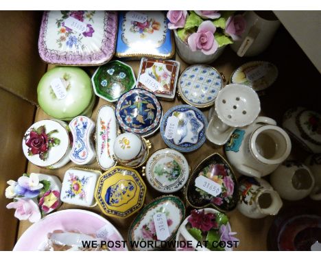 A collection of ceramics including a Belleek leprechaun, crested ware, Susie Cooper, two Caithness paperweights, Victorian co
