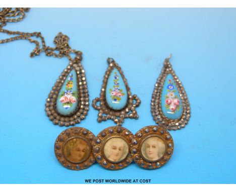 Three 19thC cut steel pendants formed of  pear shaped floral enamel central panels with a border of cut steel and a brooch fo