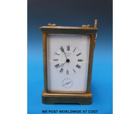 A brass carriage clock by E & E Emmanuel, Portsea, with enamelled dual Breguet hands and alarm mechanism 