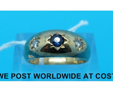 A 9ct gold ring set with a sapphire and two diamonds in star settings (Size K)