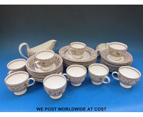 A Wedgwood dinner and tea service in the Florentine pattern (approximately 60 pieces)
