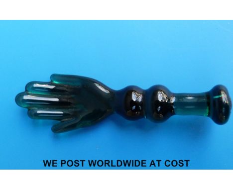 An unusual 18th/19thC green glass pipe tamper/stopper in the form of an open hand 