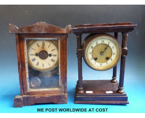 A drum cased mantel clock, raised on four Roman style pillars with two train movement together with an Edwardian alarm clock 