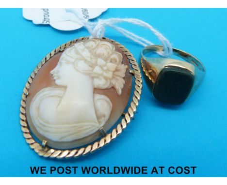 A 9ct gold ring set with a bloodstone and a cameo brooch with 9ct gold surround 