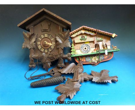 A Black Forest cuckoo clock and a weatherhouse type cuckoo clock 