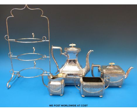 A silver plated four piece tea service together with a cake plate stand and a quantity of plated cutlery  