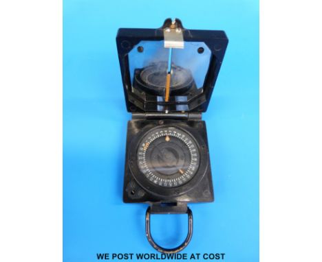 A circa WW2 marching compass together with a Europa travelling clock 