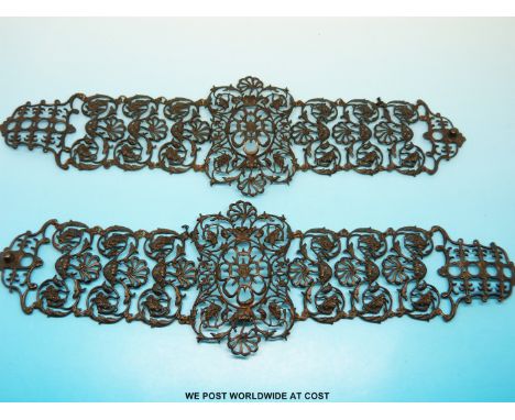 A pair of Berlin ironwork bracelets made up of stylized floral links and an oval floral panel to the centre of each 