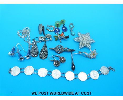 A collection of silver to include Chinese coin bracelet, silver brooch, filigree brooch, Art Deco pendant, silver and enamel 