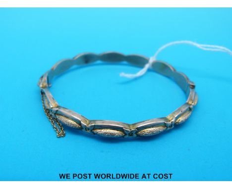 A 9ct gold bangle with marquise shape design (6.5g)
