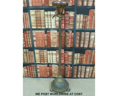 A 19thc brass and copper extending gas lamp raised on a circular footed base (height not extended 136cm)