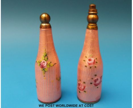 A near pair of guilloché enamel bottle shaped scent bottles with decoration of roses, tallest 6.2cm 