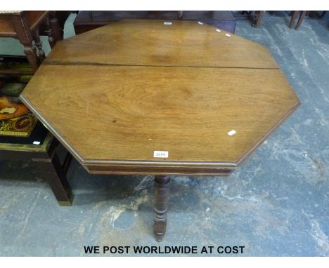 A 19thC ash or elm octagonal table with bobbin stretchers