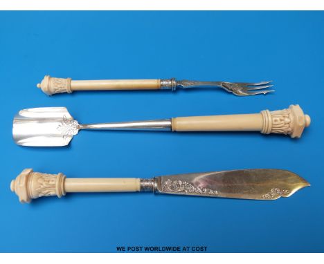 A Walker & Hall hallmarked silver ivory handled stilton scoop, Sheffield 1888 (length 22cm) together with a matching pickle f