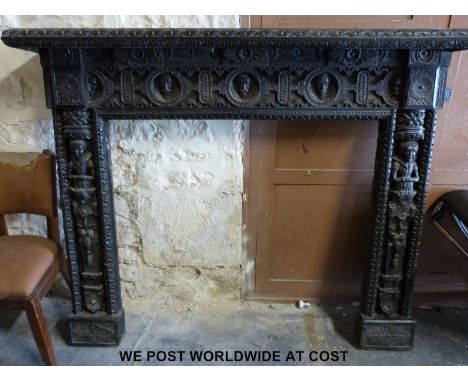 A carved and ebonised oak fire surround and overmantel with extensive figural and geometric carving, removed by the vendor fr