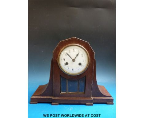 An oak two train c1930 mantel clock with glass-panelled door