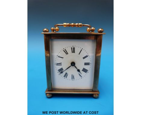 A brass French carriage clock in leather case 