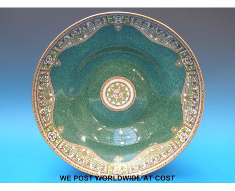 A Royal Worcester bowl in the Art Noveau style with gilt and painted floral decoration on mottled green ground, stamped to th