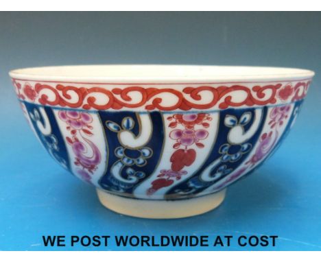 An early Worcester 'Dr Wall' period bowl, painted in underglaze blue and pink in the Queen Charlotte pattern of spiralling fl