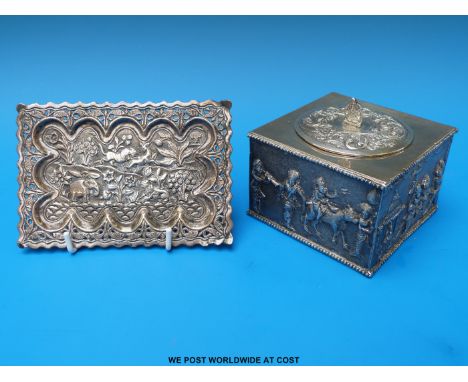 An Indian white metal caddy with embossed figures to the sides, marked to underside silver T.R T&S together with a pierced wh