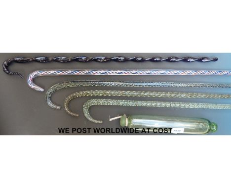 Five Nailsea glass walking sticks with twist decoration and a glass rolling pin