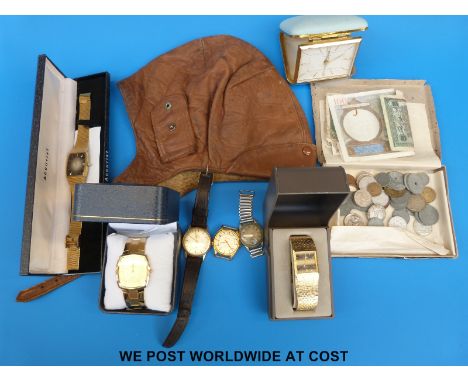 A quantity of modern wristwatches, leather helmet and a quantity of overseas currency 