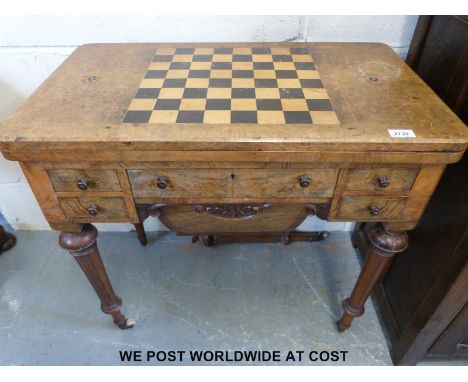 A 19thC burr walnut and inlaid fold over games and work table, the fold over top opening to reveal cribbage peg scoreboards, 