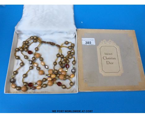 A beaded necklace in a Christian Dior box 