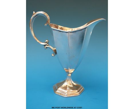 An Asprey hallmarked silver helmet shaped cream jug, London 1905, height 13cm (98g) 