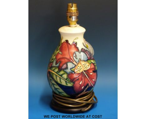 A Moorcroft table lamp in the Simeon pattern, with original label (28cm tall)