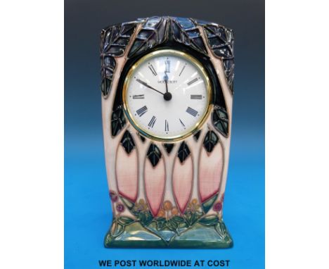 A Moorcroft mantel clock in the Cluny pattern (15cm tall)
