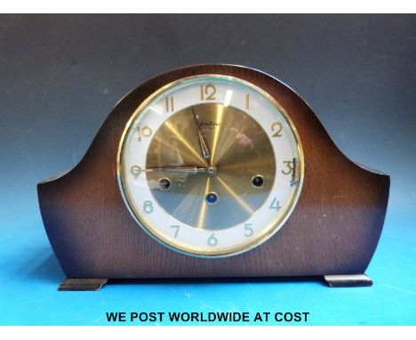A Bentima three train mantel clock with triple chime facility and key 