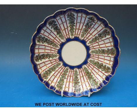 An early Worcester 'Dr Wall' period saucer dish, decorated with a version of the Hop Trellis design with berried hops alterna